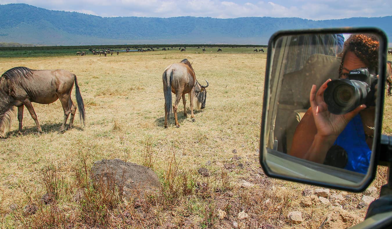 Heiser tira fotos de animais durante o Safari na África