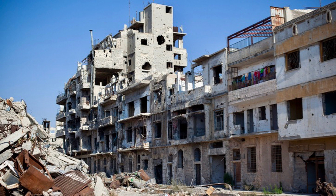 Um dos muitos edifícios danificados na Síria